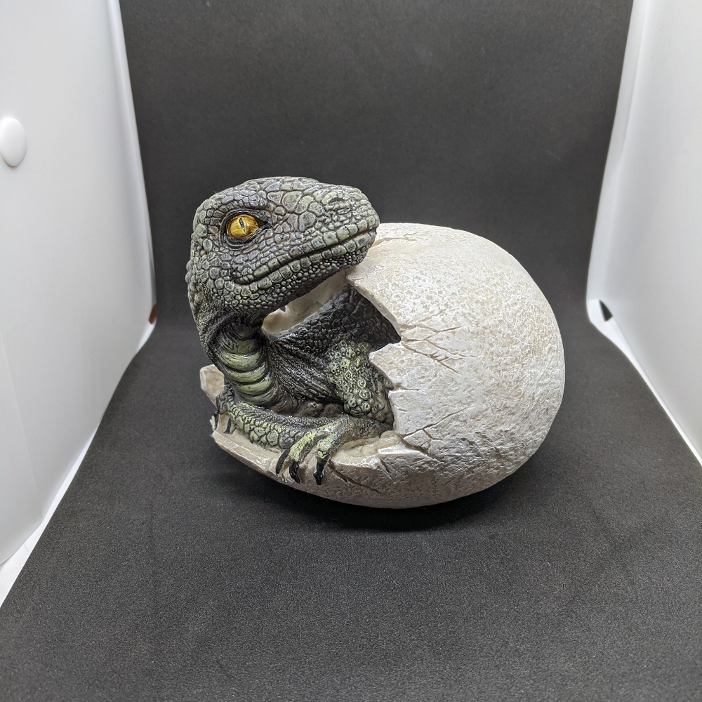 Dinosaur hatching from egg